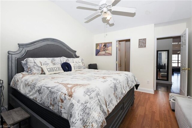 bedroom featuring dark wood-type flooring, ceiling fan, and lofted ceiling