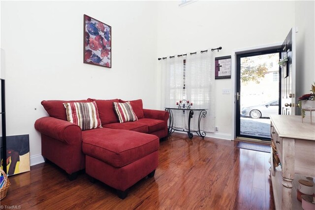 living room with dark wood-type flooring