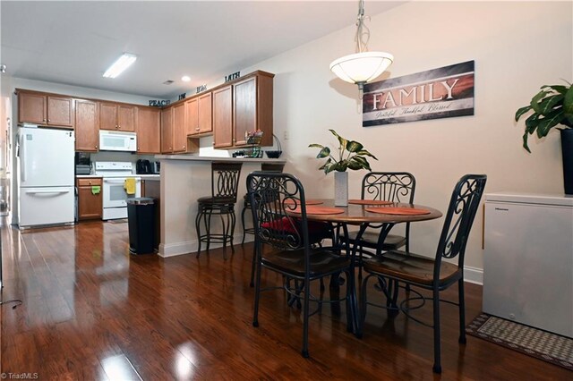 dining room featuring dark hardwood / wood-style floors