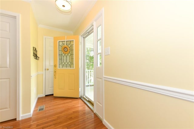 2377 Barber Rd, Elon, NC 27244 - foyer entrance with crown molding, light wood-style flooring, and baseboards