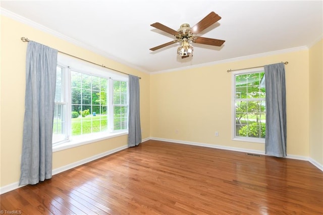 2377 Barber Rd, Elon, NC 27244 - unfurnished room featuring wood finished floors, ornamental molding, baseboards, and ceiling fan