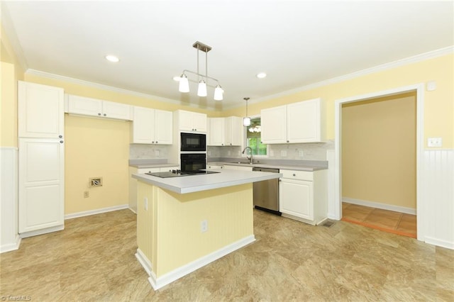 2377 Barber Rd, Elon, NC 27244 - kitchen featuring black appliances, a sink, light countertops, a center island, and white cabinets