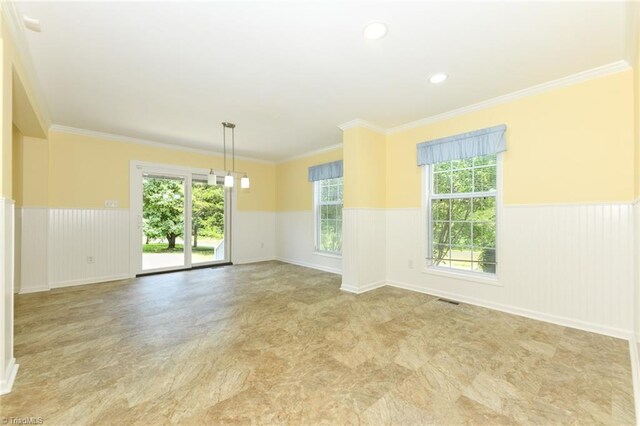 2377 Barber Rd, Elon, NC 27244 - empty room featuring wainscoting and crown molding