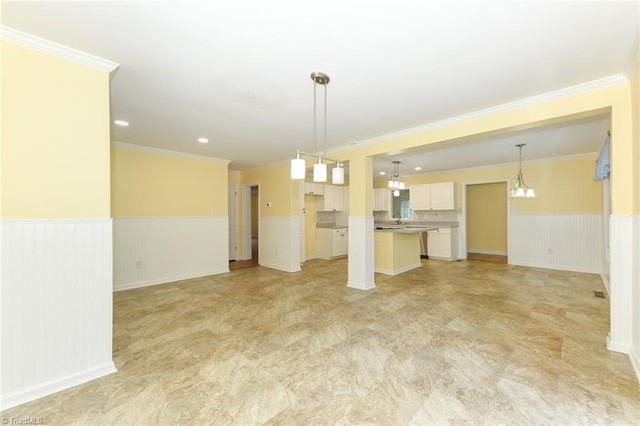 2377 Barber Rd, Elon, NC 27244 - unfurnished living room with a wainscoted wall, ornamental molding, and recessed lighting
