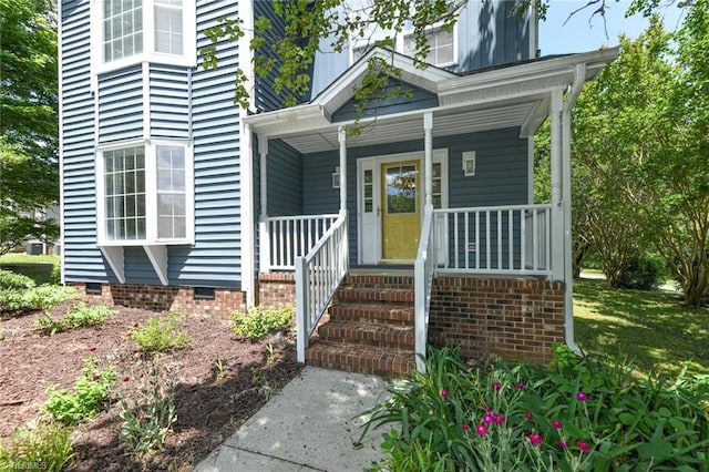 2377 Barber Rd, Elon, NC 27244 - view of exterior entry with crawl space and a porch