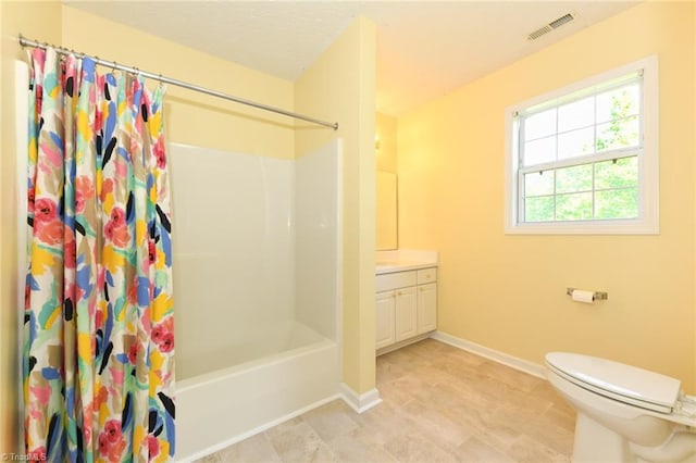 2377 Barber Rd, Elon, NC 27244 - bathroom with vanity, toilet, shower / tub combo, and baseboards