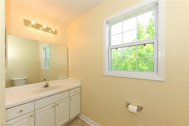2377 Barber Rd, Elon, NC 27244 - half bathroom featuring vanity, toilet, baseboards, and tile patterned floors