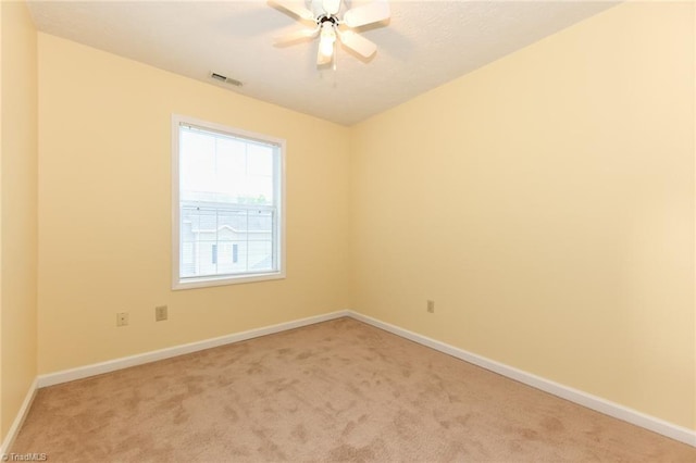 2377 Barber Rd, Elon, NC 27244 - spare room featuring light carpet, baseboards, and a ceiling fan