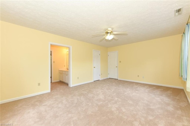 2377 Barber Rd, Elon, NC 27244 - spare room featuring a ceiling fan, light carpet, baseboards, and a textured ceiling