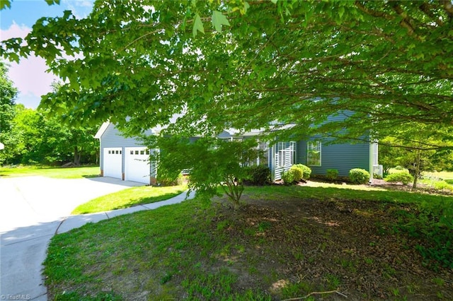 2377 Barber Rd, Elon, NC 27244 - obstructed view of property with a garage, a front yard, and concrete driveway