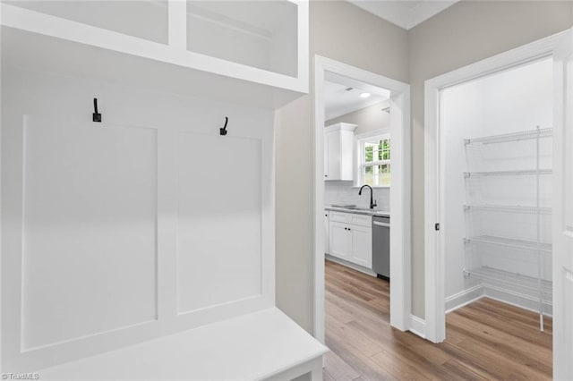 6975 Orchard Path Dr, Clemmons, NC 27012 - mudroom with wood finished floors, a sink, and baseboards