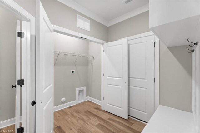 6975 Orchard Path Dr, Clemmons, NC 27012 - clothes washing area featuring electric dryer hookup, light wood finished floors, ornamental molding, and baseboards