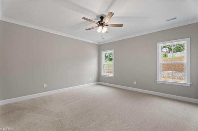 6975 Orchard Path Dr, Clemmons, NC 27012 - spare room featuring baseboards, crown molding, light colored carpet, and ceiling fan