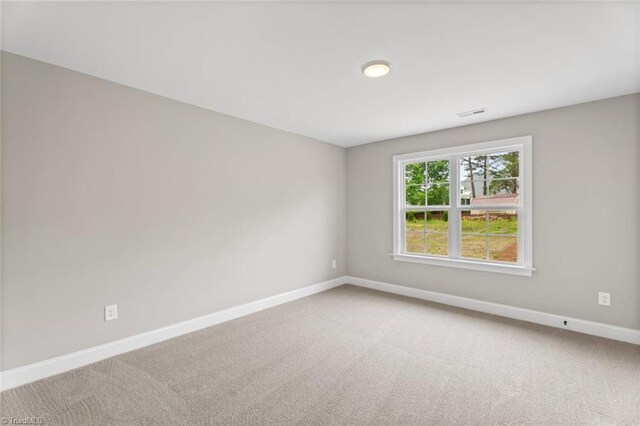 6975 Orchard Path Dr, Clemmons, NC 27012 - empty room with baseboards and light colored carpet