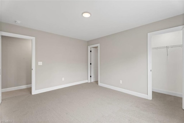 6975 Orchard Path Dr, Clemmons, NC 27012 - unfurnished bedroom with carpet flooring, a closet, and baseboards