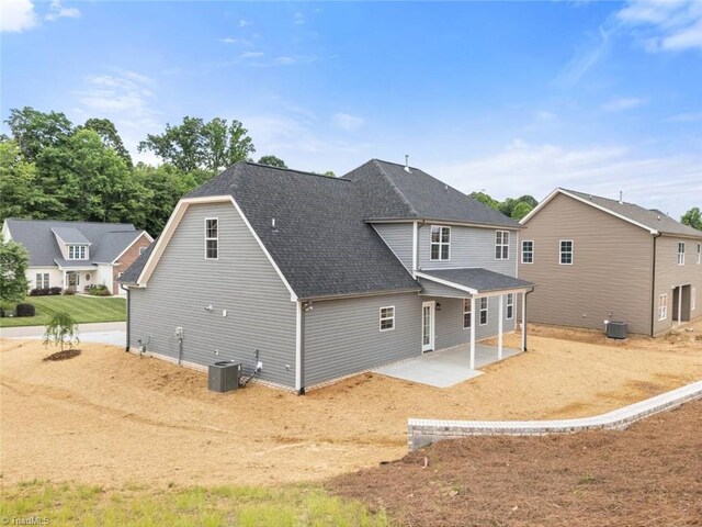 6975 Orchard Path Dr, Clemmons, NC 27012 - rear view of house featuring cooling unit, a patio area, and roof with shingles