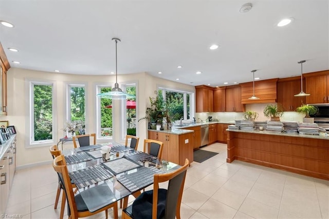 dining space featuring light tile patterned floors