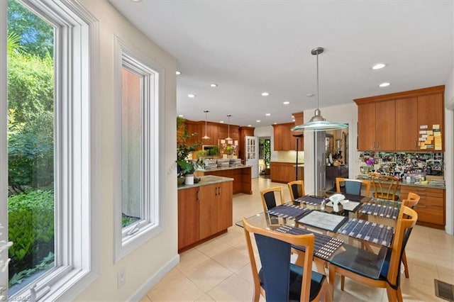 dining space with light tile patterned floors