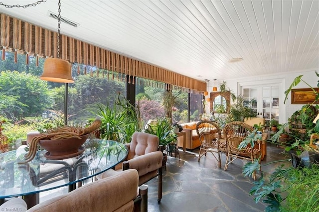 sunroom / solarium featuring wooden ceiling