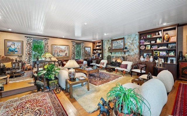 living room with a fireplace and light hardwood / wood-style floors