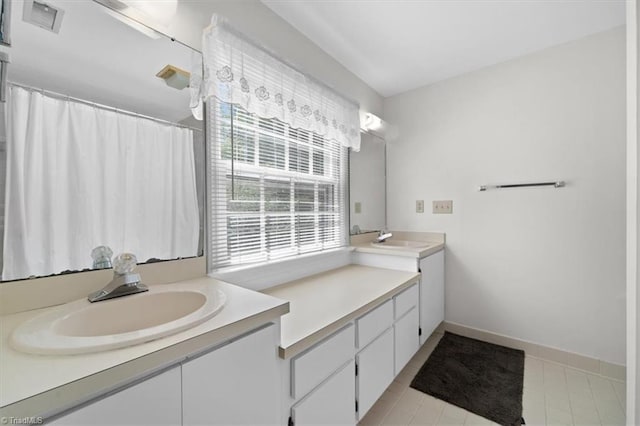 bathroom with vanity and tile patterned floors