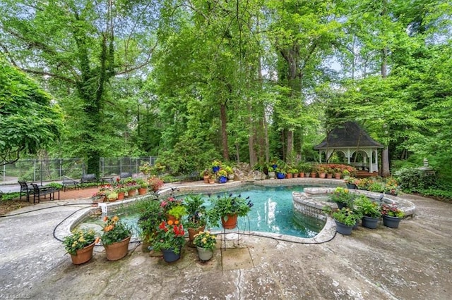 view of pool featuring a gazebo and a patio