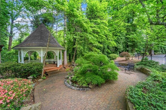 view of community with a gazebo and a patio area