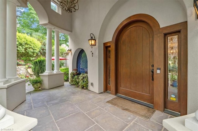 entrance to property featuring covered porch