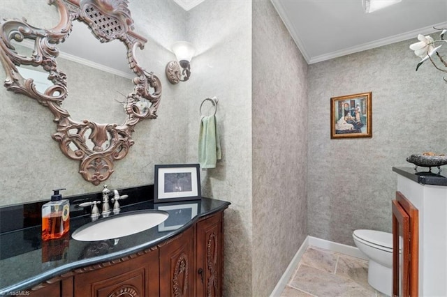 bathroom featuring vanity, ornamental molding, and toilet