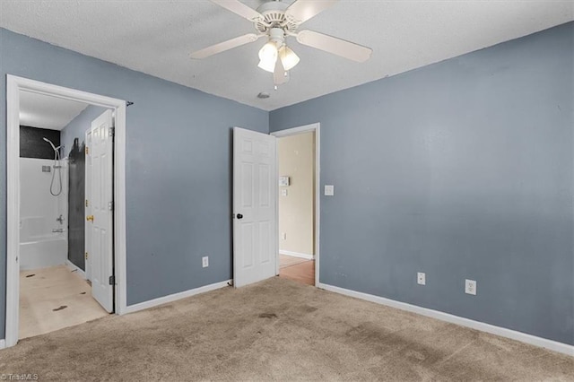4103 Scotney Dr, Greensboro, NC 27407 - unfurnished bedroom featuring carpet, connected bathroom, and ceiling fan