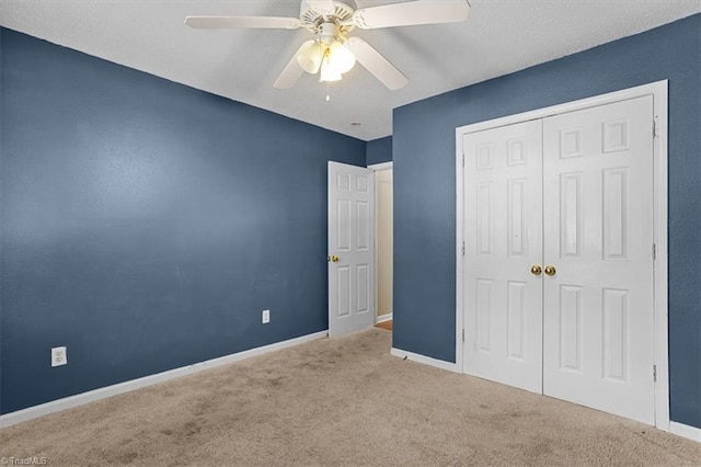 4103 Scotney Dr, Greensboro, NC 27407 - unfurnished bedroom with carpet, a closet, and ceiling fan