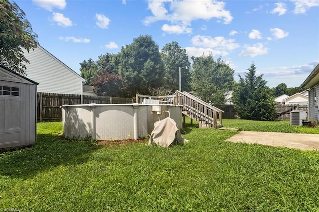4103 Scotney Dr, Greensboro, NC 27407 - fenced backyard featuring a storage unit