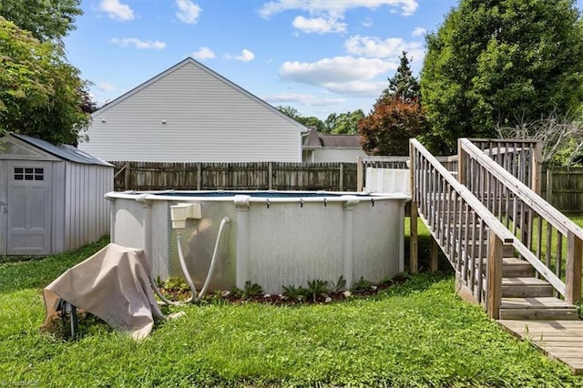 4103 Scotney Dr, Greensboro, NC 27407 - view of swimming pool with a fenced backyard, a storage shed, and stairway