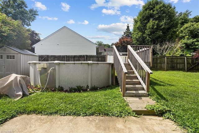 4103 Scotney Dr, Greensboro, NC 27407 - fenced backyard featuring a shed and stairway