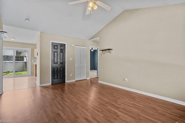 4103 Scotney Dr, Greensboro, NC 27407 - unfurnished living room featuring ceiling fan, wood finished floors, and vaulted ceiling
