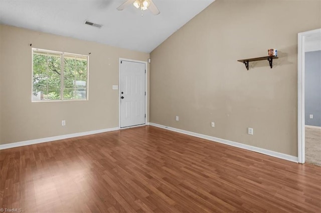 4103 Scotney Dr, Greensboro, NC 27407 - unfurnished room with ceiling fan, wood finished floors, and vaulted ceiling