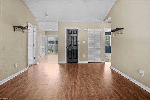 4103 Scotney Dr, Greensboro, NC 27407 - empty room with wood finished floors and vaulted ceiling