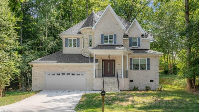 view of front of home with brick siding, concrete driveway, a front yard, roof with shingles, and an attached garage