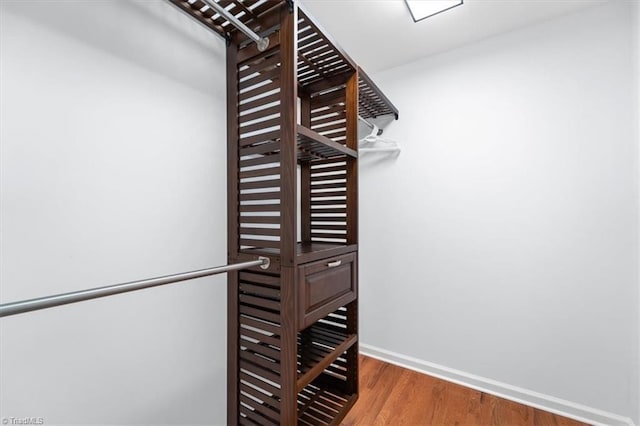 spacious closet with wood finished floors
