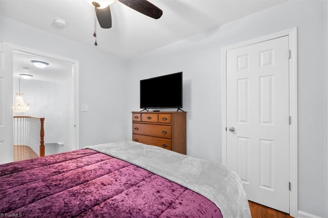 bedroom featuring a ceiling fan and wood finished floors