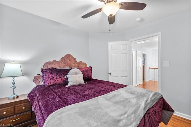 bedroom with ceiling fan and wood finished floors