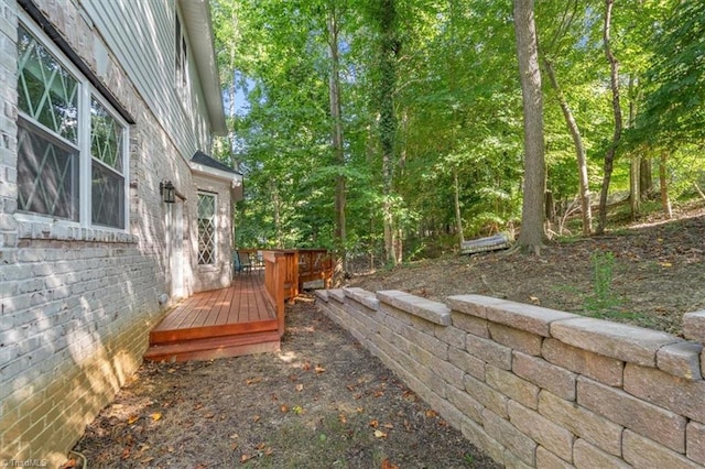 view of yard with a wooden deck