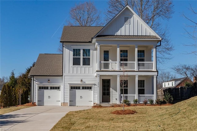 view of front facade featuring covered porch, a front yard, a garage, and a balcony