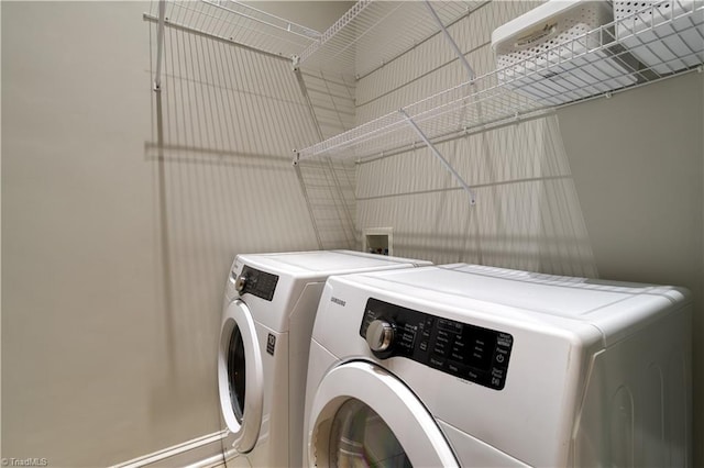 laundry room featuring washer and dryer and laundry area