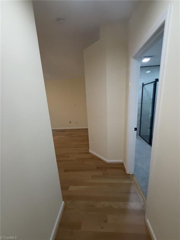 corridor featuring light hardwood / wood-style flooring