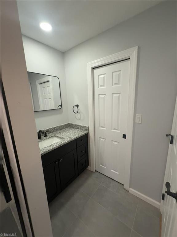 bathroom with vanity and tile patterned flooring