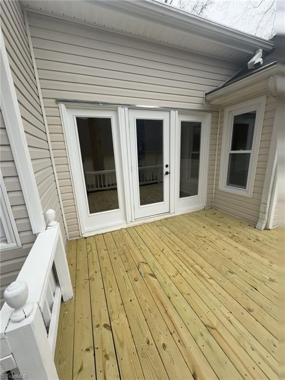 wooden terrace featuring french doors