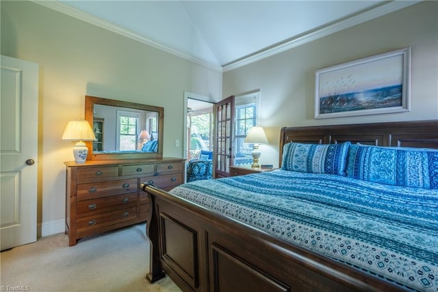 bedroom with crown molding, baseboards, vaulted ceiling, and light colored carpet
