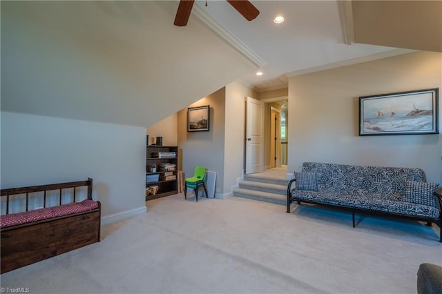 living area featuring carpet flooring, baseboards, ornamental molding, and ceiling fan