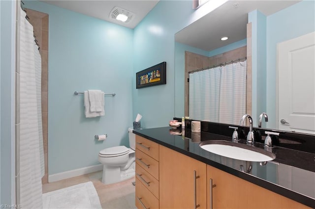 bathroom featuring a shower with curtain, vanity, toilet, and tile patterned floors